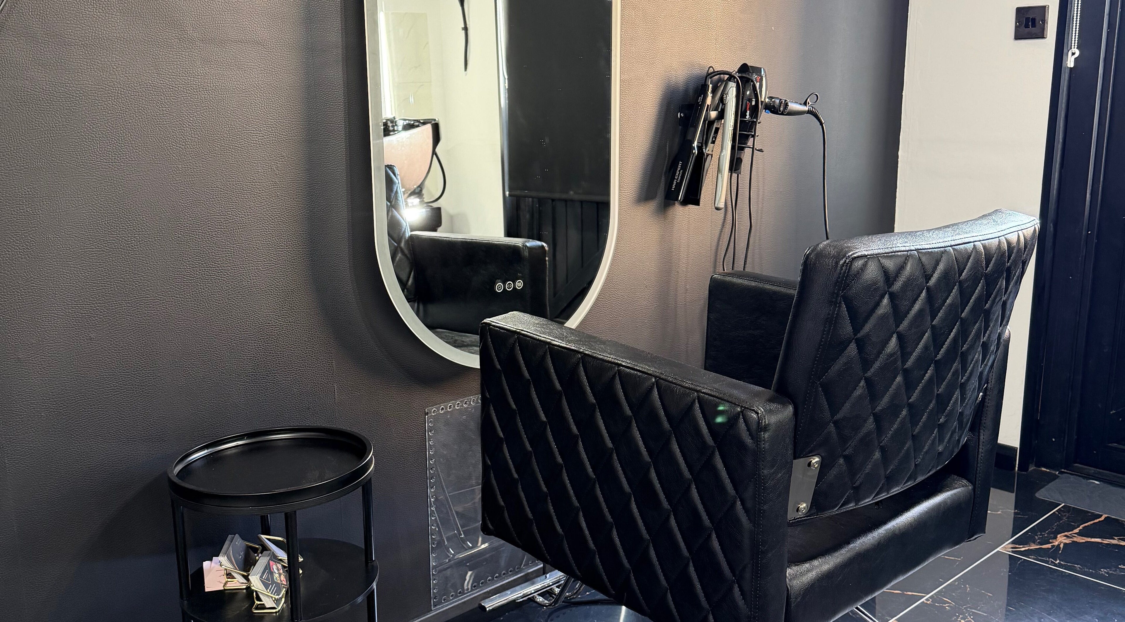Elegant salon chair and mirror at Elena Manea - Beauty Room, Leadenhall, England, GB.