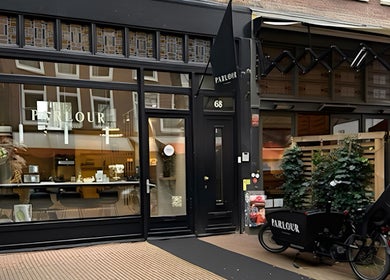 Facade of Parlour Amsterdam in Amsterdam, Noord-Holland, NL with elegant shopfront and stylish design.