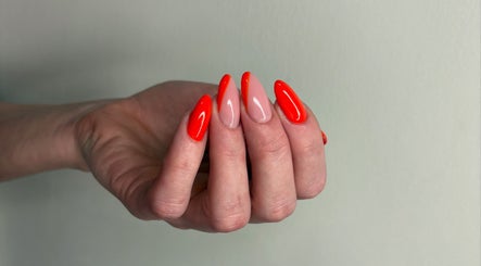 Bright red manicure at Just Beauty in Carlisle, England, GB, showcasing elegant nail art.