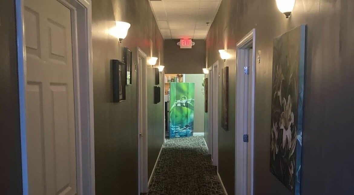 Tranquil hallway at Relax Massage, Douglasville, Georgia, US, with soft lighting and peaceful decor.