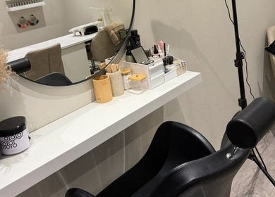Stylish styling station at The Beauty Bar Swansea, Llansamlet, Wales, GB with chair and mirror setup.