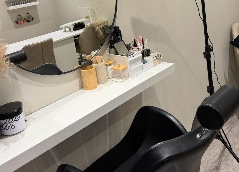 Stylish styling station at The Beauty Bar Swansea, Llansamlet, Wales, GB with chair and mirror setup.