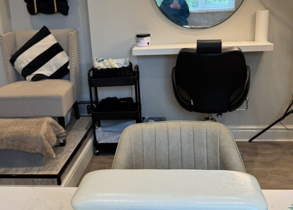 Modern makeup station at The Beauty Bar Swansea, Llansamlet, Wales, GB with stylish seating and elegant decor.
