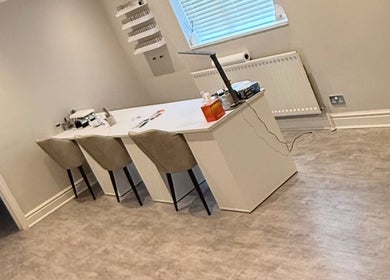 Modern manicure station at The Beauty Bar Swansea, Llansamlet, Wales, GB, featuring sleek decor and seating.