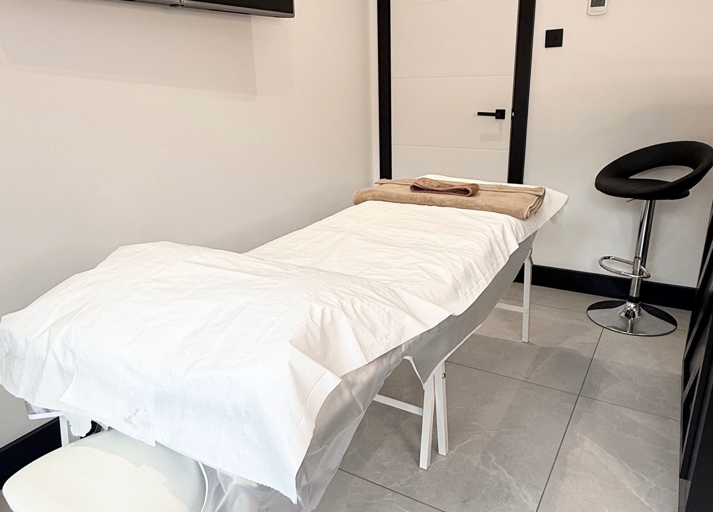 Calming treatment room at Secret Bodies by Anna in Poole, England, GB with a massage table and serene decor.