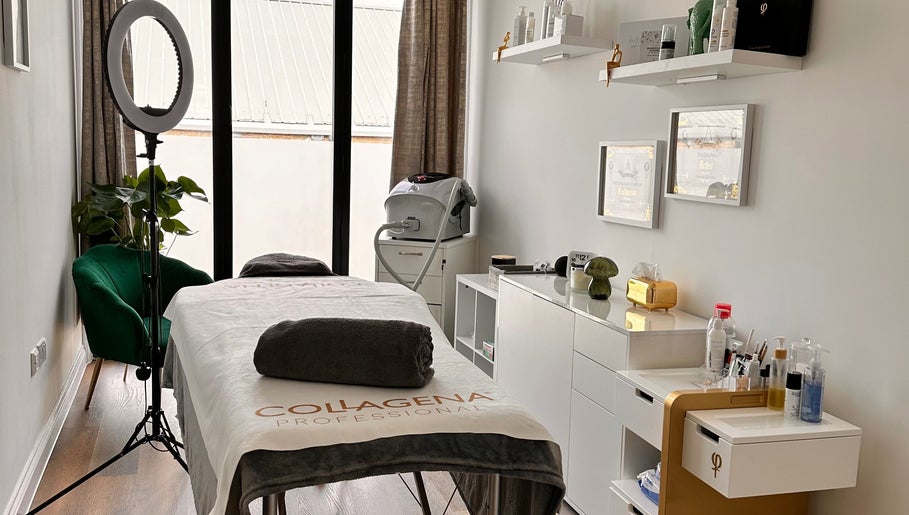 Serene treatment room at Brows & Beauty by Vu, London, England, GB, featuring a plush spa bed and equipment.