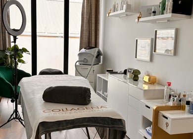 Serene treatment room at Brows & Beauty by Vu, London, England, GB, featuring a plush spa bed and equipment.