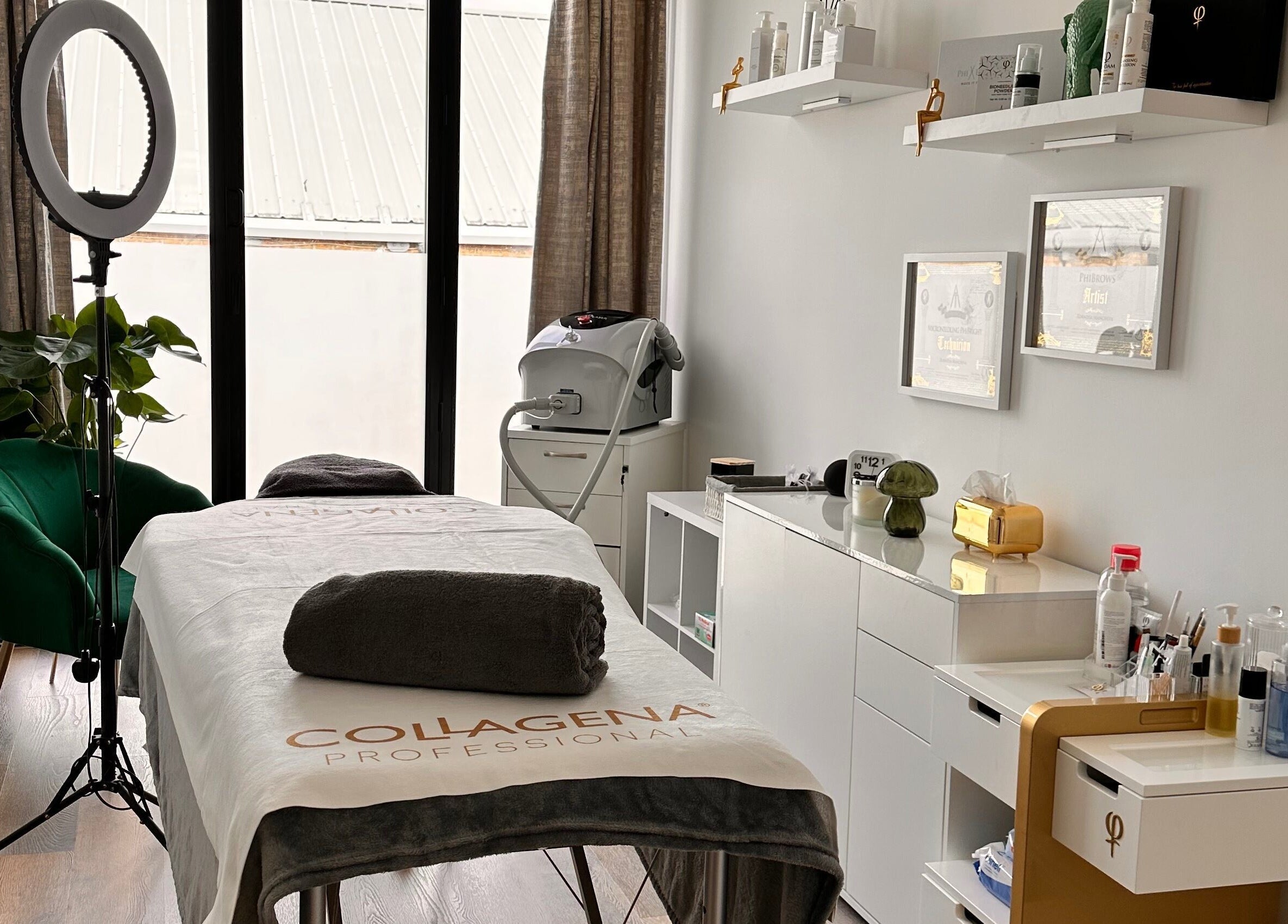 Relaxing treatment room at Brows & Beauty by Vu in London, England, GB, featuring elegant decor and advanced equipment.