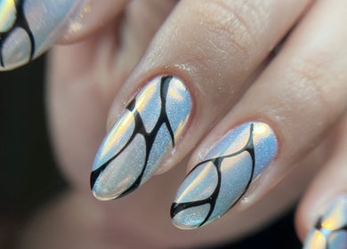Elegant iridescent nails with black abstract lines at Tini Nails, Buenos Aires, Ciudad Autónoma De Buenos Aires, AR.