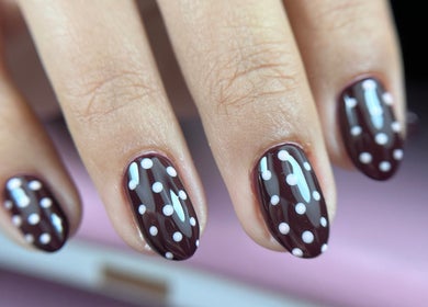 Close-up of chic polka dot nail art at Tini Nails, Buenos Aires, Ciudad Autónoma De Buenos Aires, AR.