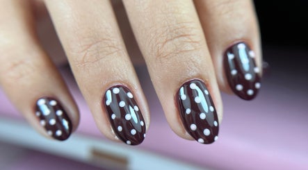 Close-up of chic polka dot nail art at Tini Nails, Buenos Aires, Ciudad Autónoma De Buenos Aires, AR.