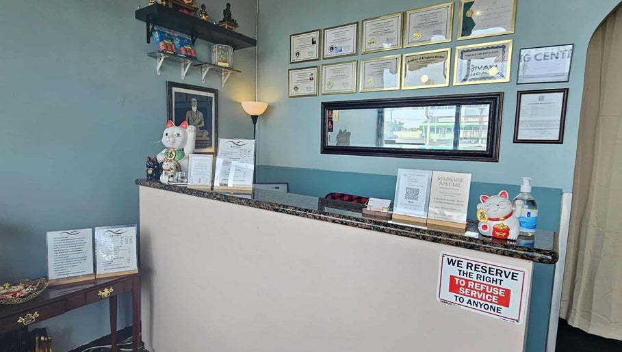 Reception desk at Jivaka Massage & Wellness in Lomita, California, US, adorned with welcoming decor.