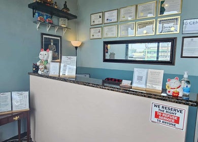 Reception desk at Jivaka Massage & Wellness in Lomita, California, US, adorned with welcoming decor.