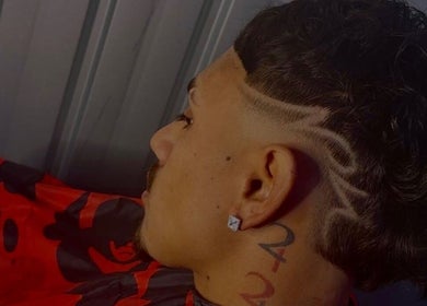 Intricate fade haircut design at SWAG DA BARBER, Melbourne, Victoria, AU. Modern style and precision.