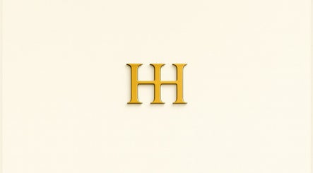 HH Permanent Makeup logo in gold on cream background, Glendale, California, US.