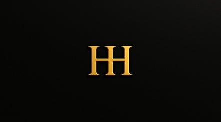 Gold HH emblem for HH Permanent Makeup in Glendale, California, US on black background.