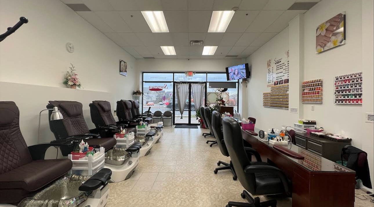 Relaxing interior of Summer Nail & Spa in Surrey, British Columbia, CA with pedicure chairs and nail stations.