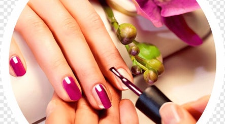 Manicure session at Rapha Wellness, Johannesburg, Gauteng, ZA showcasing vibrant pink nails and floral decor.