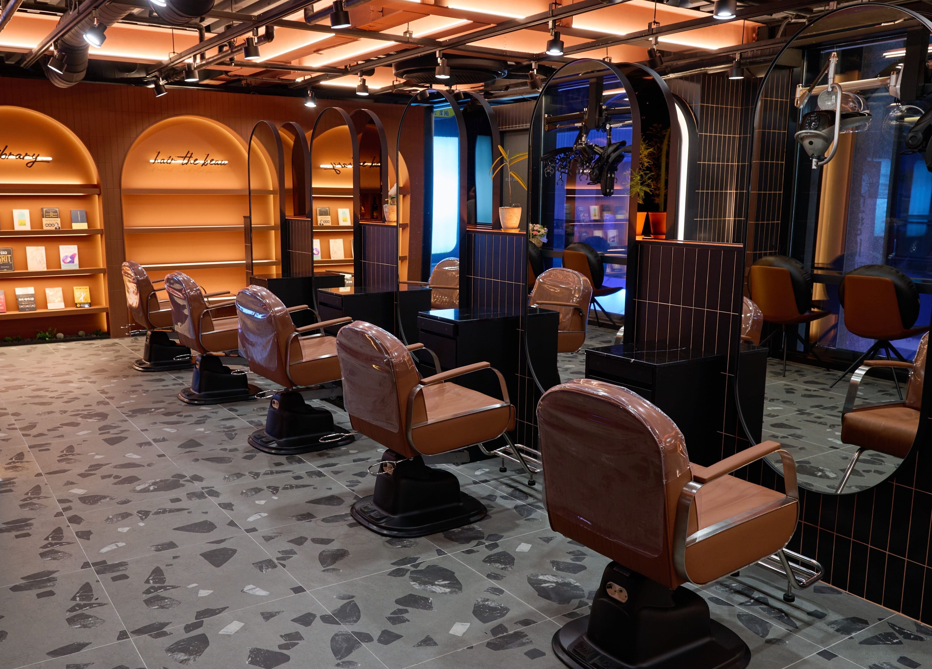 Stylish interior of Hair The Beau Myeongdong salon located in 서울특별시, 서울특별시, KR with elegant seating.