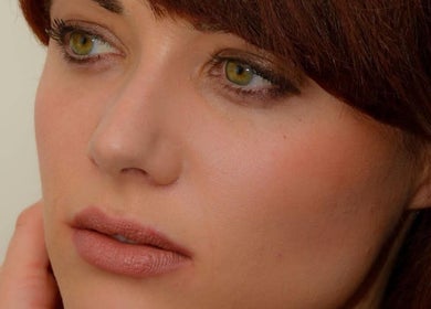 Close-up of a woman's face highlighting smooth skin at Elevated Beauty by Erica, Bourne, Massachusetts, US.