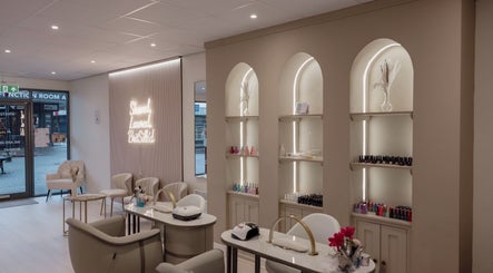 Chic nail lounge at BritSilk Wellness Lounge in Royton, England, GB, showcasing stylish decor and manicure stations.