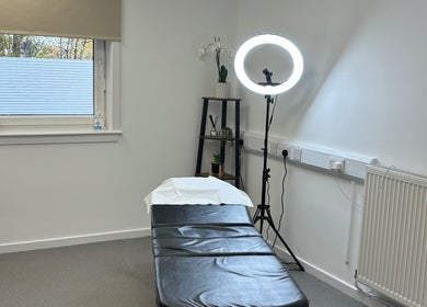 Treatment room at Microblading by Kimberley in Rosyth, Scotland, GB, featuring a bed and ring light.