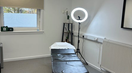 Treatment room at Microblading by Kimberley in Rosyth, Scotland, GB, featuring a bed and ring light.