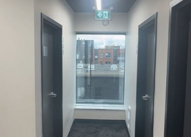 Calm hallway at TouchedByChanel, Montréal, Québec, CA with natural light from large windows.