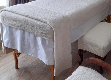 Elegant massage table at Black Excellence Massage Studio, Pretoria, Gauteng, ZA exudes relaxation.