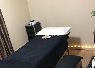 Relaxing massage room at Black Excellence Massage Studio, Pretoria, Gauteng, ZA, featuring a cozy massage table.