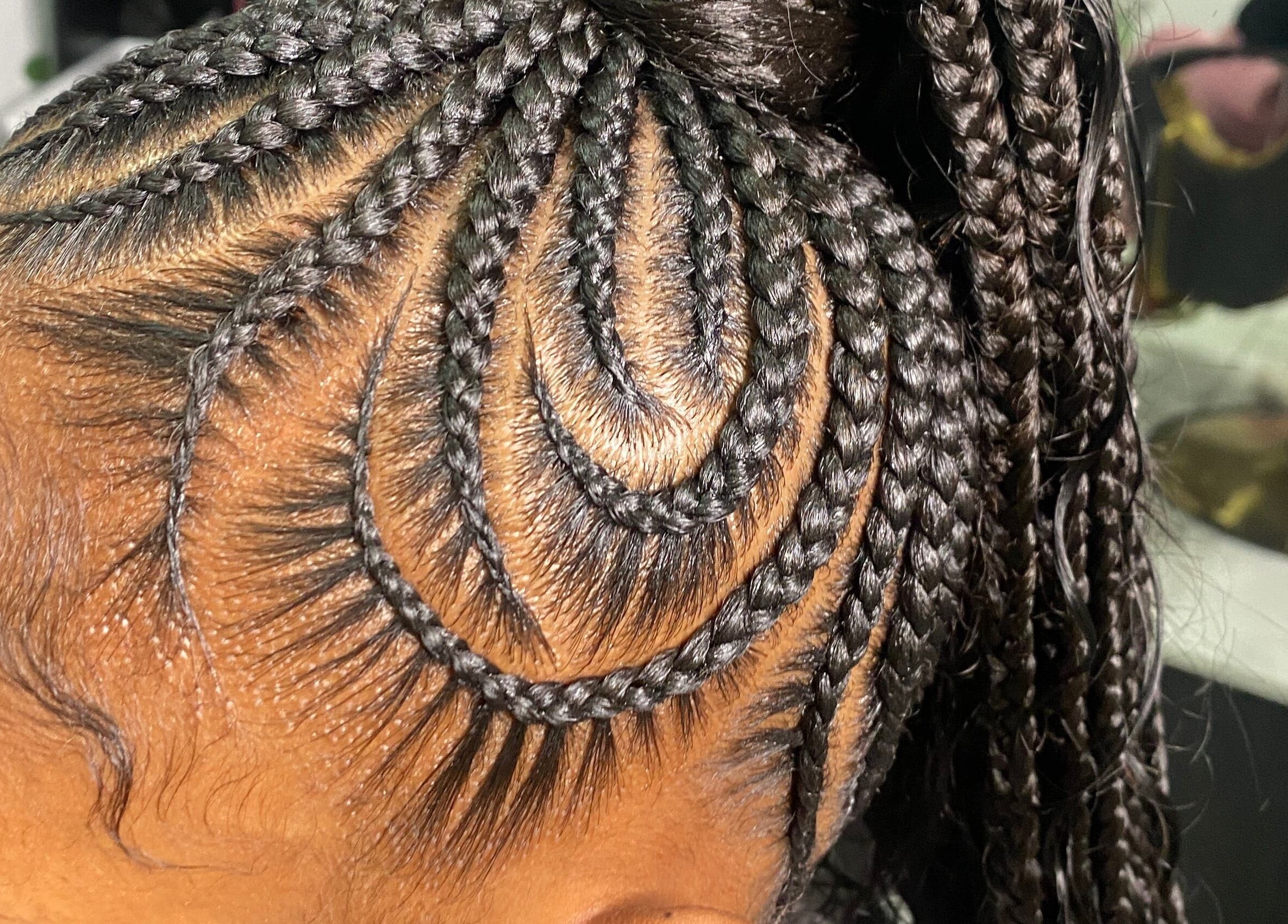 Intricate braided hairstyle at Goddess Strands, Philipsburg, SX.