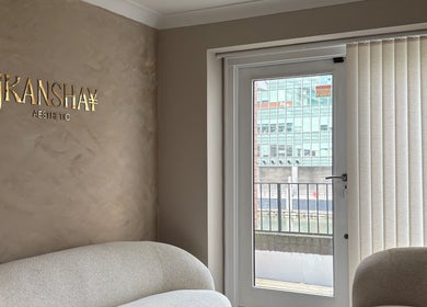 Stylish seating area at JKANSHAY AESTHETIC CLINIC, London, England, GB with cozy sofa and modern decor.