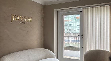 Stylish seating area at JKANSHAY AESTHETIC CLINIC, London, England, GB with cozy sofa and modern decor.