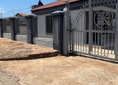 Stylish entrance gate at Nailsbytshepang in Soshanguve, Gauteng, ZA, showcasing a welcoming exterior.