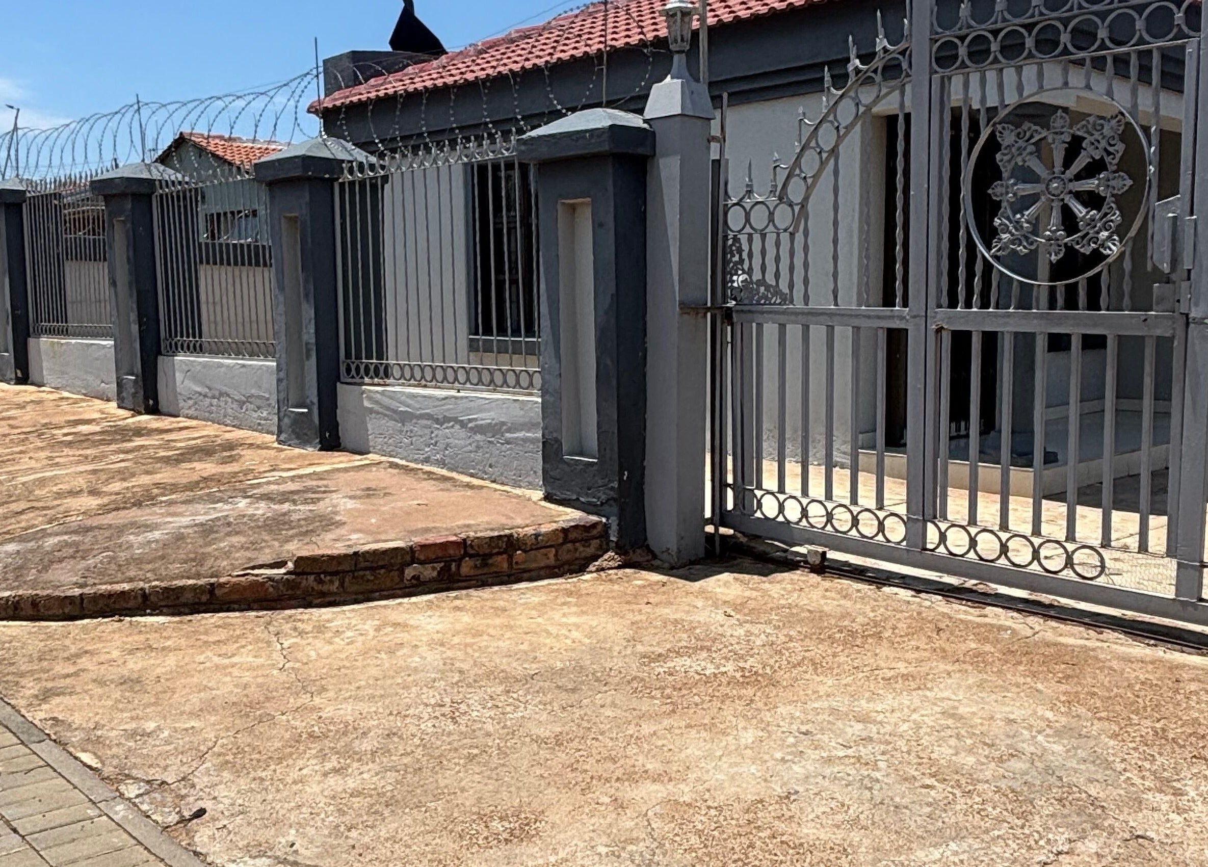 Stylish entrance gate at Nailsbytshepang in Soshanguve, Gauteng, ZA, showcasing a welcoming exterior.