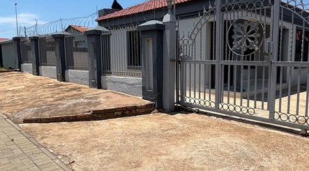 Stylish entrance gate at Nailsbytshepang in Soshanguve, Gauteng, ZA, showcasing a welcoming exterior.