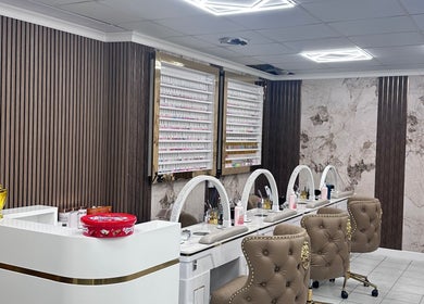Elegant nail salon setup at Ivy Nails and Beauty, Yeovil, England, GB, featuring plush chairs and manicured accents.