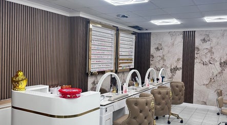 Elegant nail salon setup at Ivy Nails and Beauty, Yeovil, England, GB, featuring plush chairs and manicured accents.