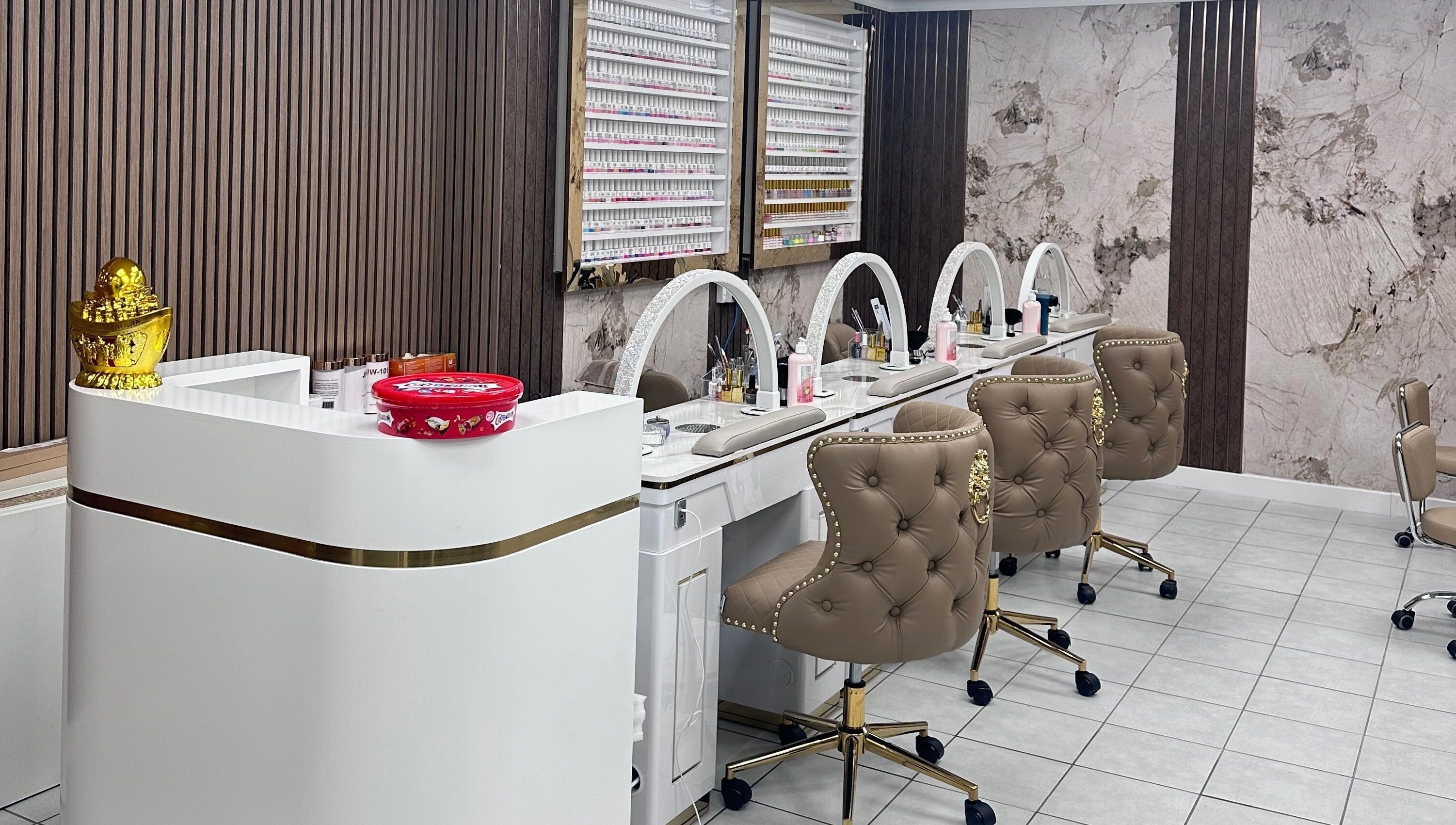 Luxurious nail stations at Ivy Nails and Beauty, Yeovil, England, GB, featuring plush chairs and chic decor.