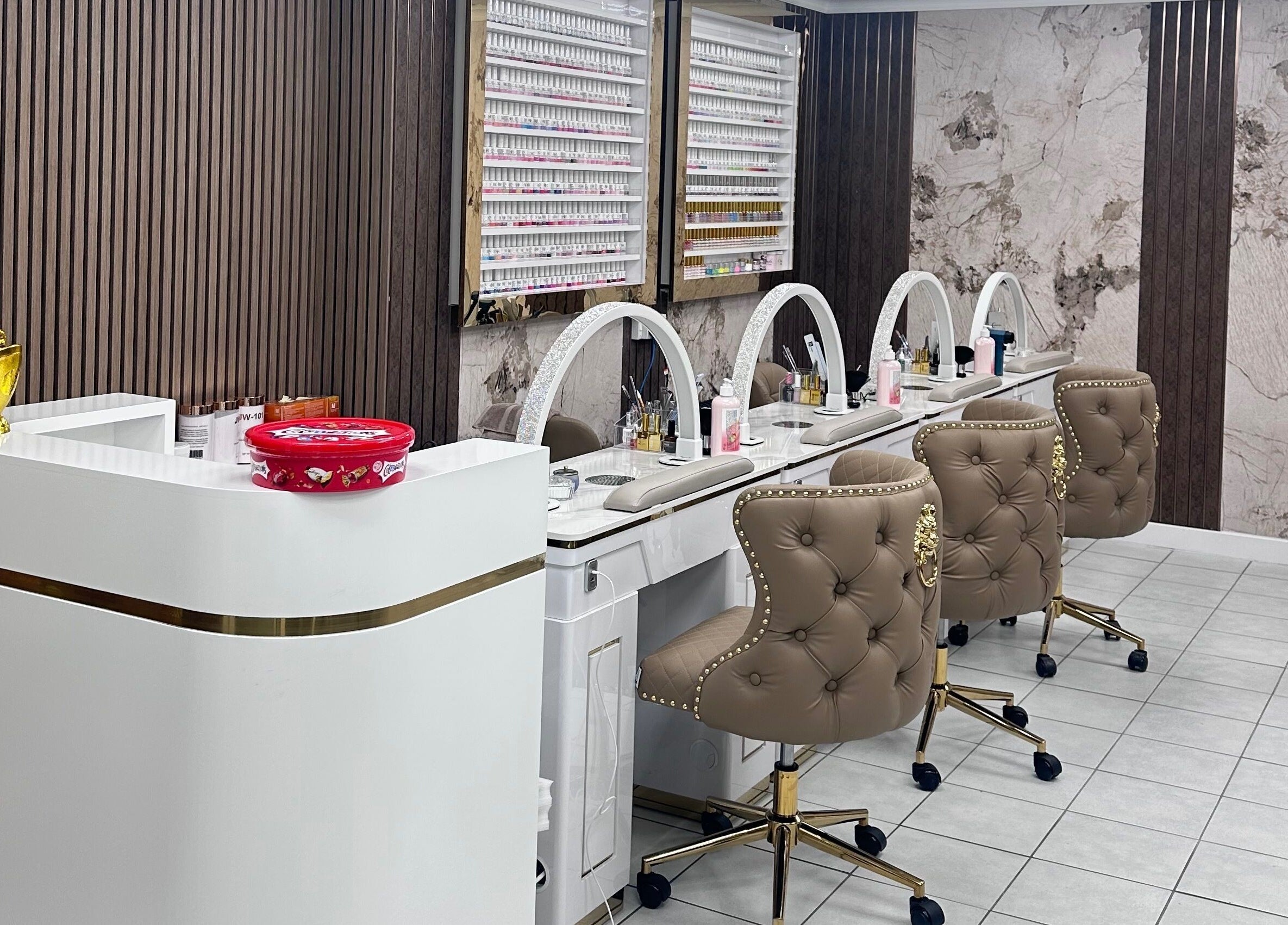 Luxurious nail stations at Ivy Nails and Beauty, Yeovil, England, GB, featuring plush chairs and chic decor.