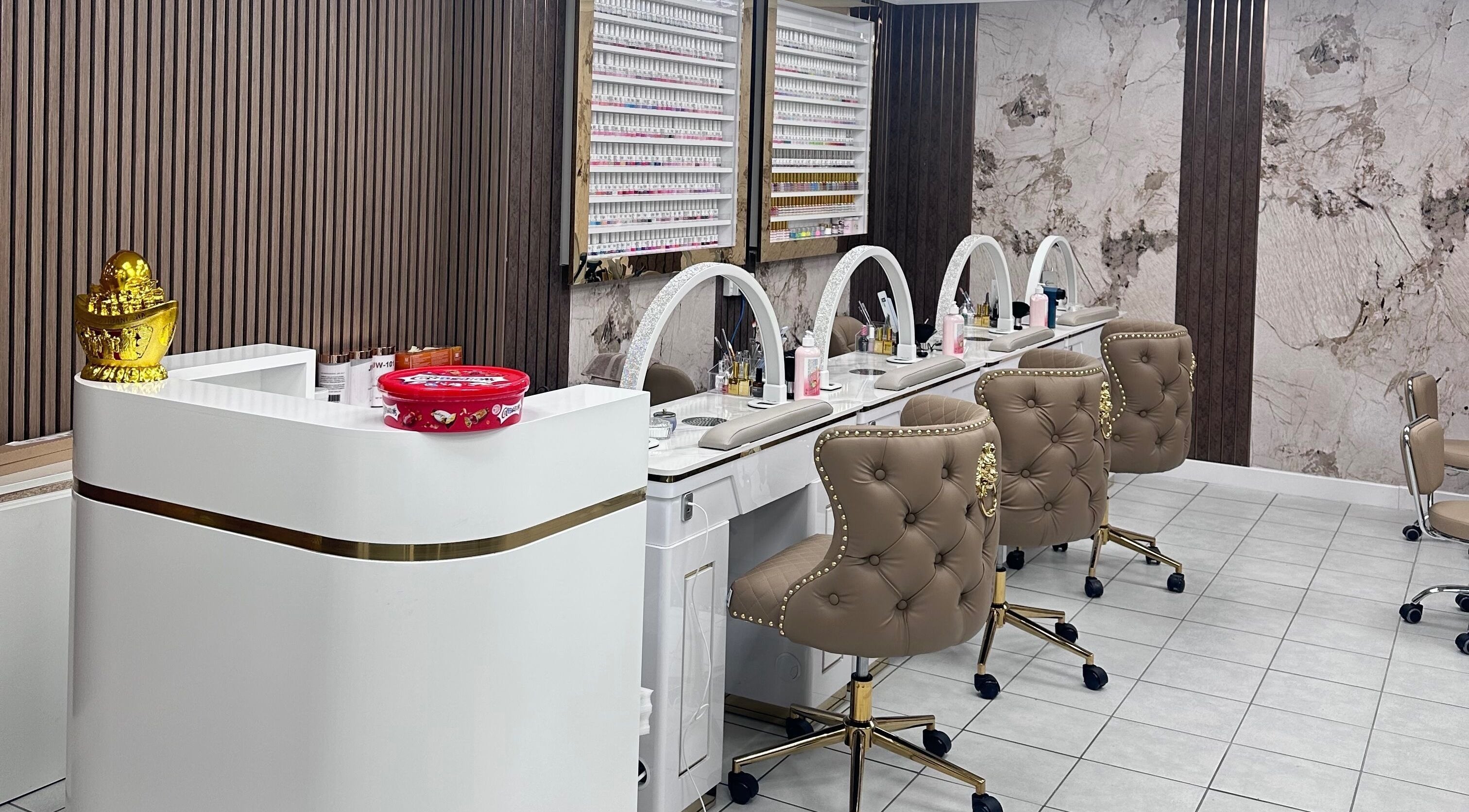 Luxurious nail stations at Ivy Nails and Beauty, Yeovil, England, GB, featuring plush chairs and chic decor.