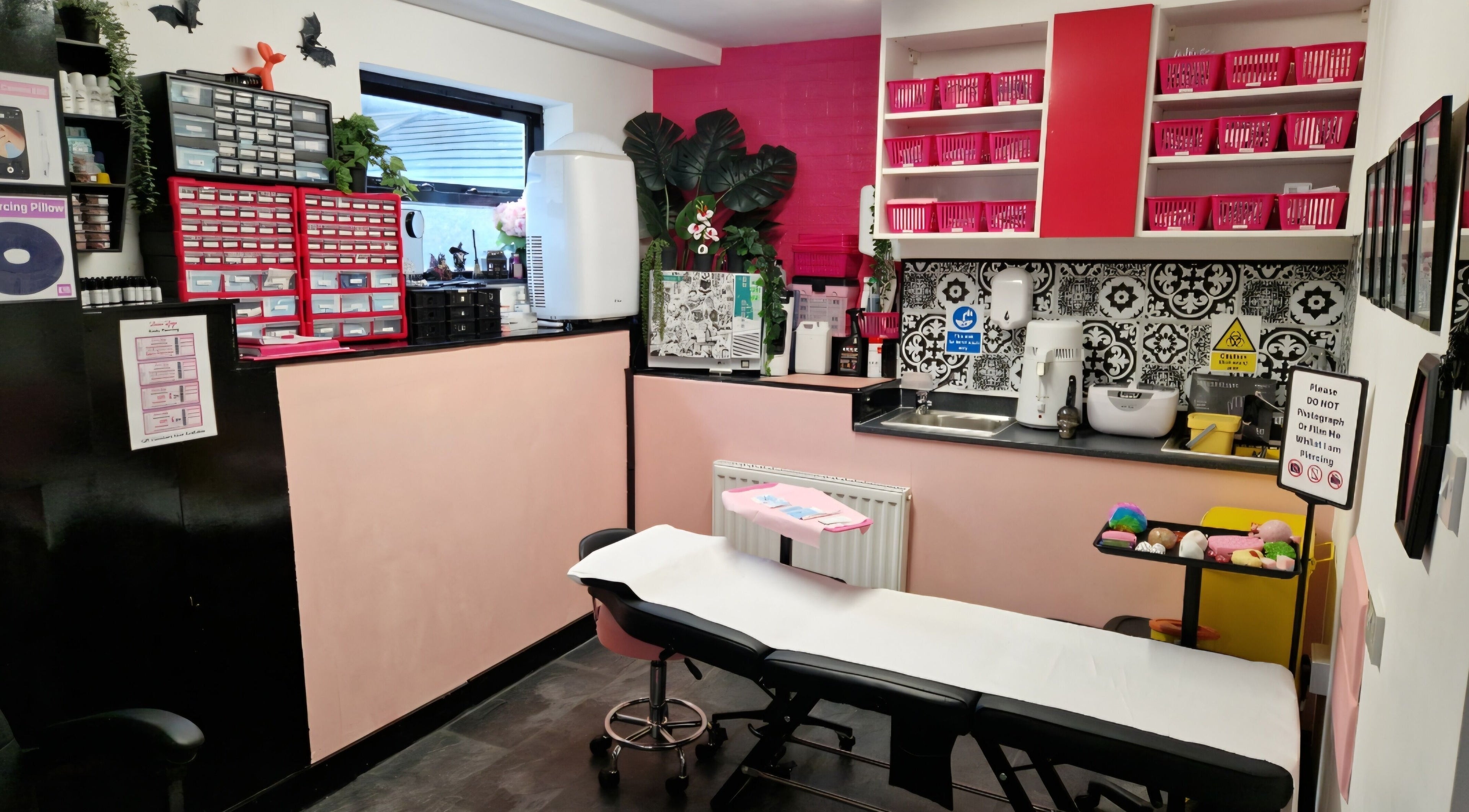 Cozy interior of Laura Ljaze Body Piercing, Liverpool, England, GB, showcasing a modern design with vibrant decor.