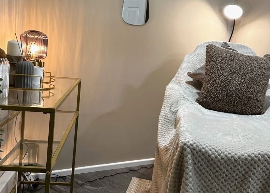 Relaxing treatment room at SKIN VOWS @ R Studio, New Mills, England, GB with ambient lighting and plush seating.