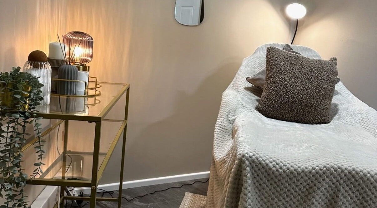 Relaxing treatment room at SKIN VOWS @ R Studio, New Mills, England, GB with ambient lighting and plush seating.
