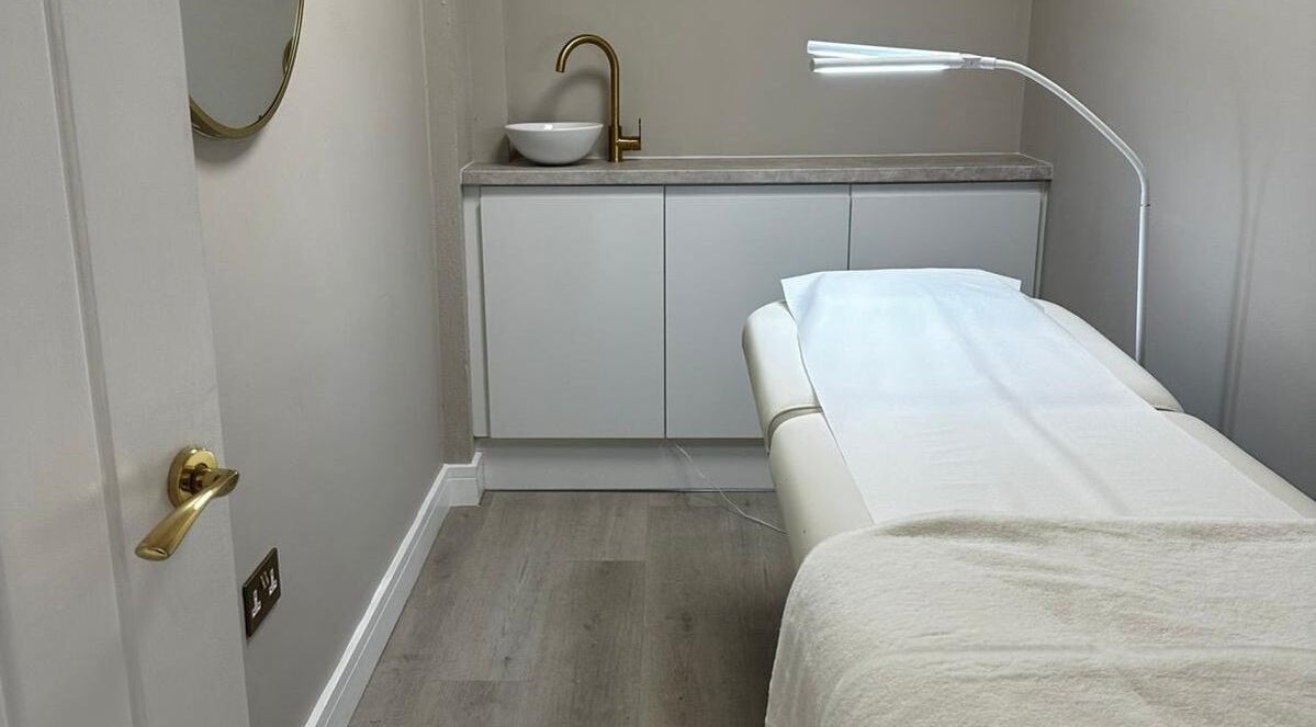 Calming treatment room at SKIN VOWS @ Sarah Gregory Beauty, Cheshire, England, GB, featuring a plush bed.