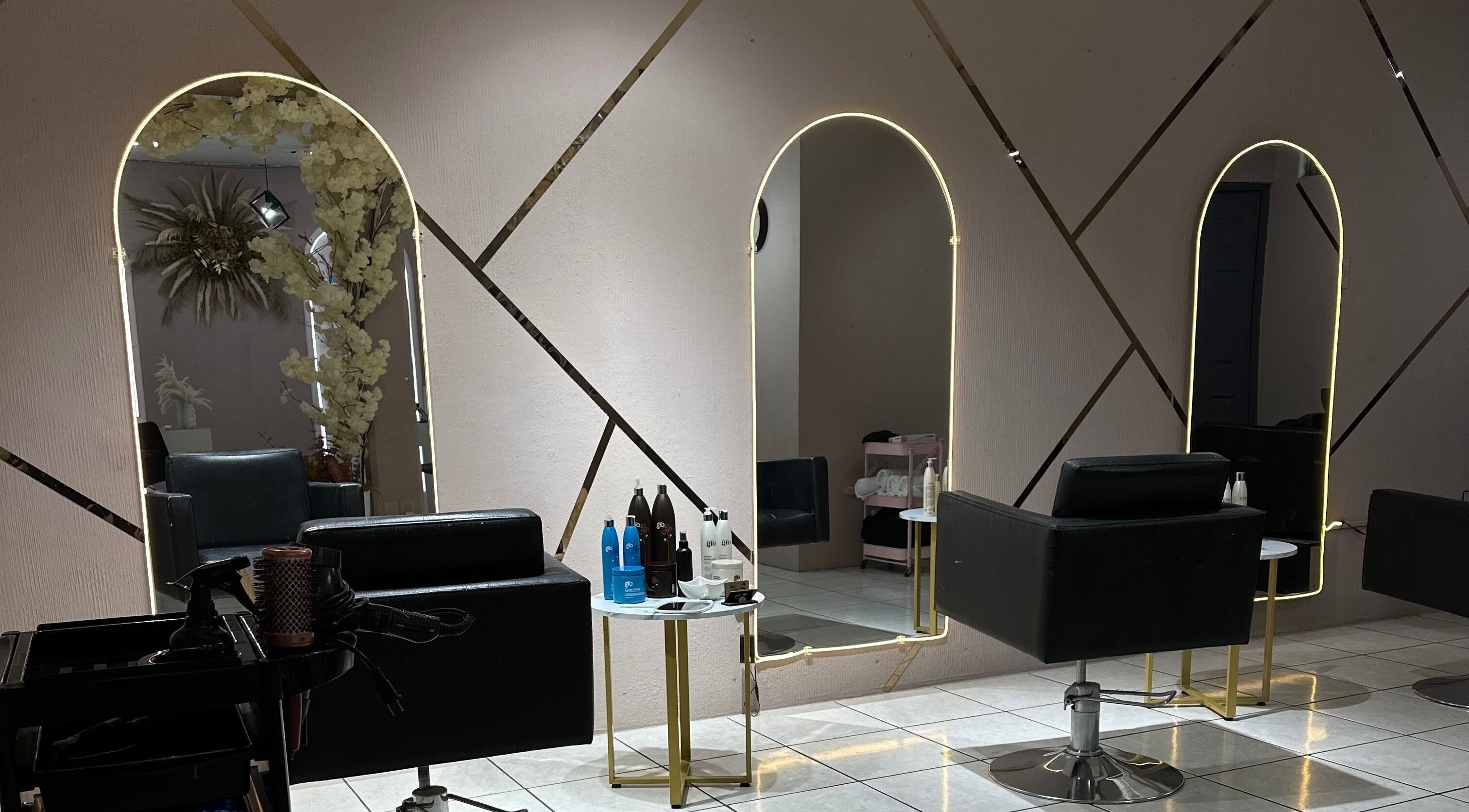 Chic salon stations at onetouchsalongt in Ciudad De Guatemala, Guatemala, GT with stylish mirrors and decor.