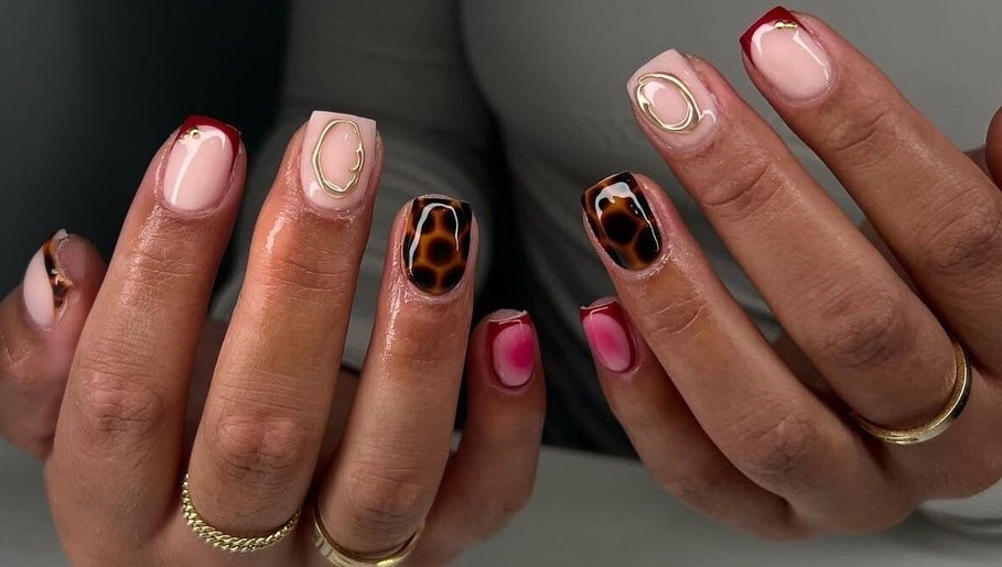 Stylish nail designs at NailsByAdina, Willemstad, Curaçao, CW showcasing unique patterns and vibrant colors.