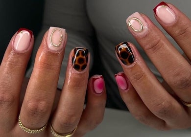 Stylish nail designs at NailsByAdina, Willemstad, Curaçao, CW showcasing unique patterns and vibrant colors.