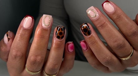 Stylish nail designs at NailsByAdina, Willemstad, Curaçao, CW showcasing unique patterns and vibrant colors.