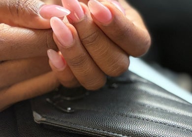 Elegant pink manicure done at NailsByAdina, Willemstad, Curaçao, CW, showcasing expert nail care.